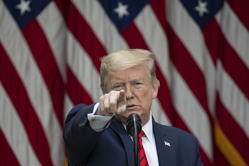 AP file photo, Alex Brandon / In this May 11, 2020 photo, President Donald Trump points as he speaks about the coronavirus during a press briefing in the Rose Garden of the White House.