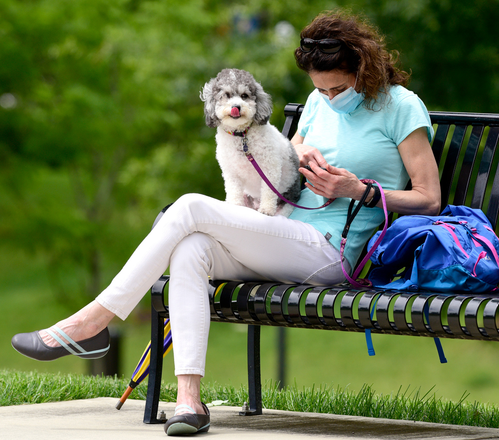 Staff Photo by Robin Rudd / UTC professor Tracye Pool and her dog, Lucy, wait for the rally to begin. UTC students and the Chattanooga community held a demonstration at the school's Chamberlain Field to show solidarity with Black Lives Matter.