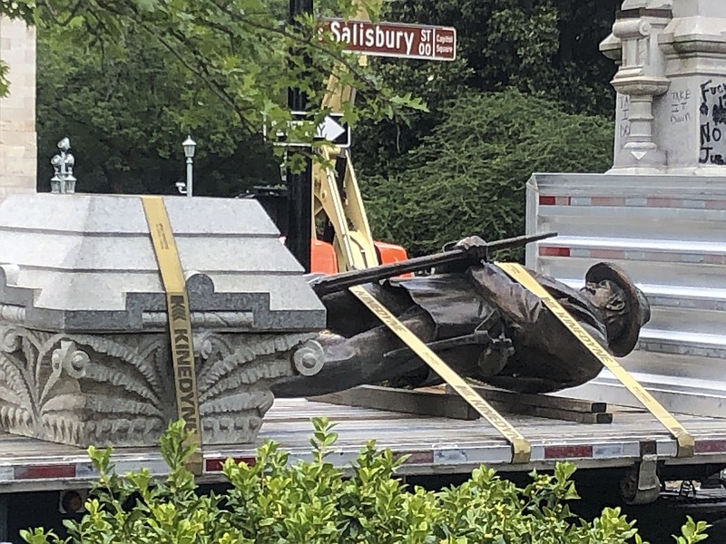 The Associated Press / The statue of a Confederate soldier sits on a flatbed truck at the Old Capitol in Raleigh, N.C., after protesters pulled it down earlier this month.