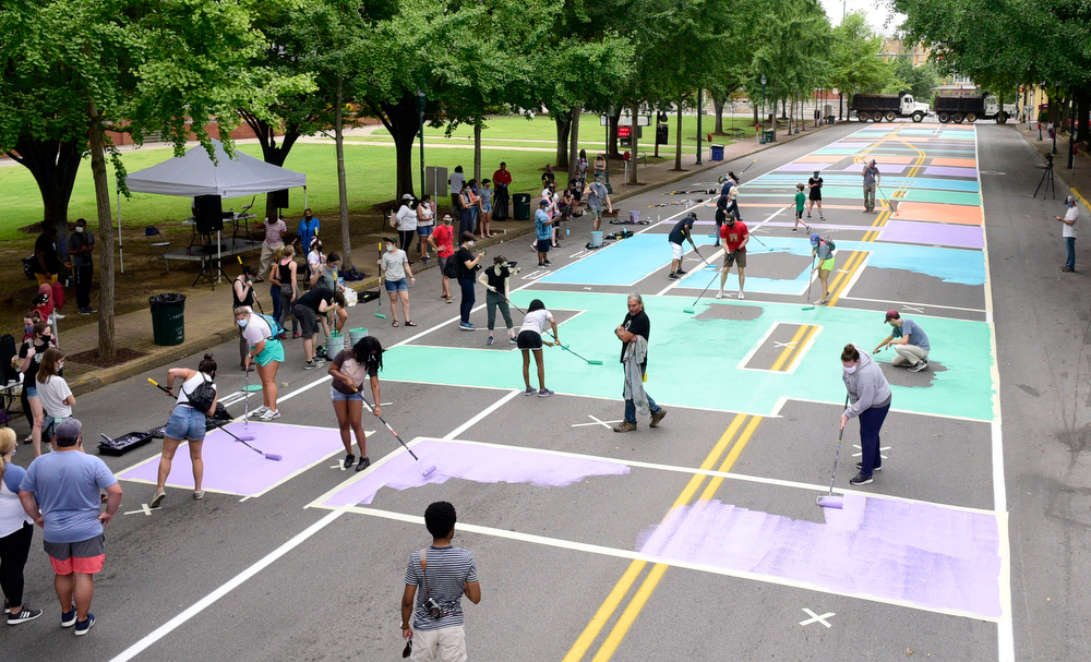 Staff Photo by Robin Rudd / On Martin Luther King Jr. Blvd. the last letters of "Black Lives Matter !" are filled in to complete the mural.