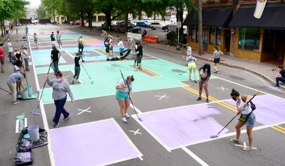 Staff Photo by Robin Rudd / On Martin Luther King Jr. Blvd. the last letters of "Black Lives Matter !" are filled in to complete the mural.