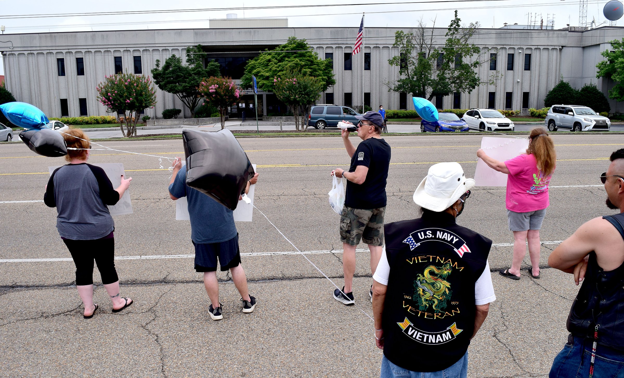 Staff Photo by Robin Rudd / People gathered, June 27, 2020, along Amnicola Highway, in front of the Chattanooga Police Services Building, to rally in support of area police.