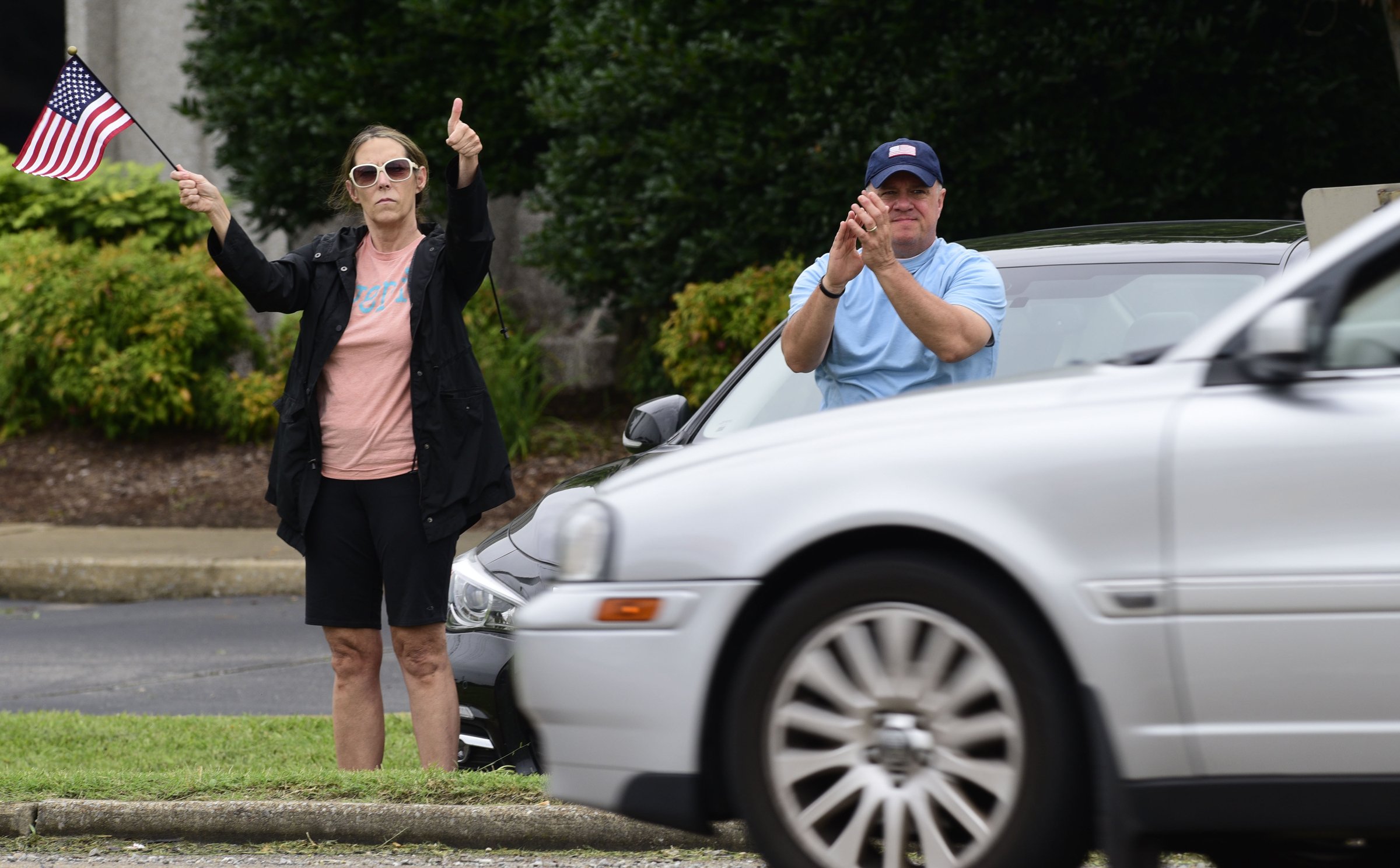Staff Photo by Robin Rudd / People react as passing motorist blow their horns in support of the police. People gathered, June 27, 2020, along Amnicola Highway, in front of the Chattanooga Police Services Building, to rally in support of area police.