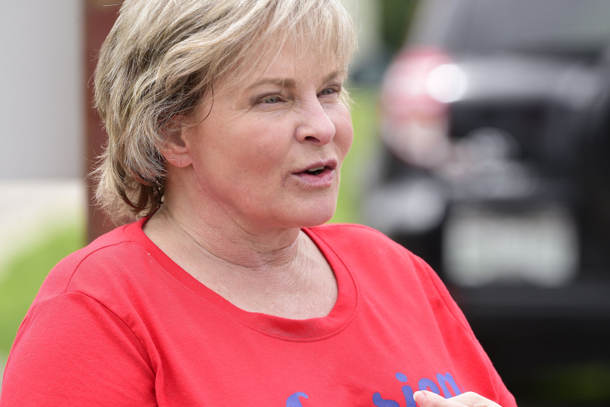 Staff Photo by Robin Rudd / Tammy Lyda speaks to the Times Free Press. People gathered, June 27, 2020, along Amnicola Highway, in front of the Chattanooga Police Services Building, to rally in support of area police.