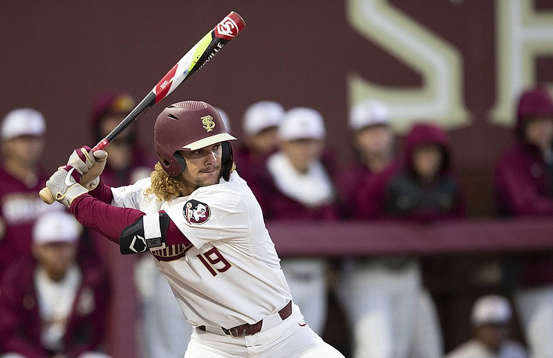 AP photo by Alicia Devine / Florida State outfielder Elijah Cabell hits during a home game against Cincinnati on Feb. 21 in Tallahassee.