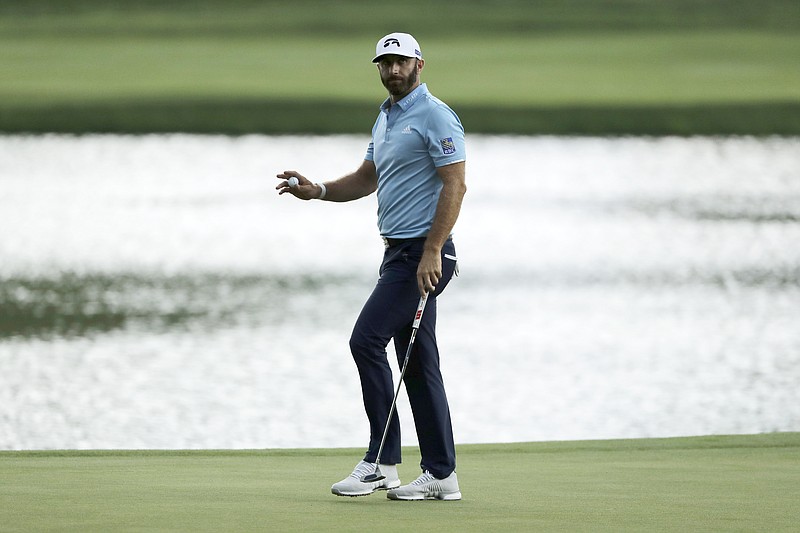 AP photo by Frank Franklin II / Dustin Johnson reacts after sinking his putt on the 15th green at TPC River Highlands during the final round of the PGA Tour's Travelers Championship on Sunday in Cromwell, Conn. Johnson closed with a 67 for a one-stroke win over Kevin Streelman.