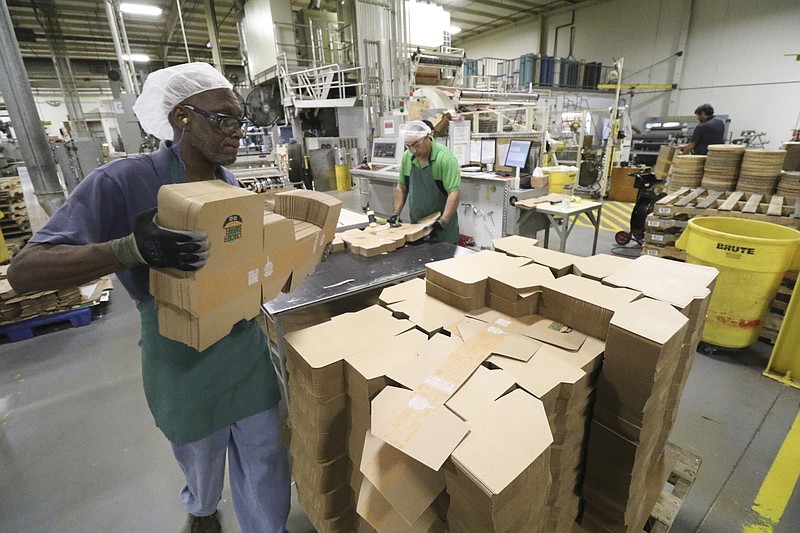 Staff file photo / Roland Jones works on the production line at Southern Champion Tray in Chattanooga in 2017.