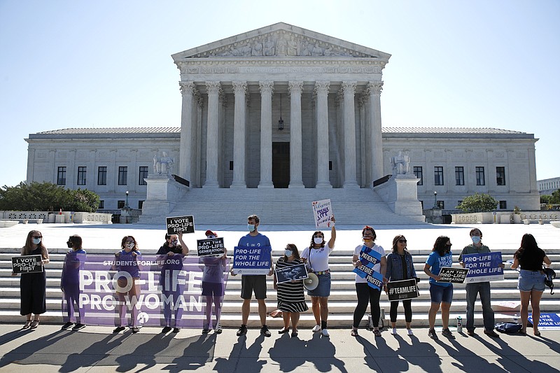 Anti-abortion protesters wait outside the Supreme Court for a decision, Monday, June 29, 2020 in Washington on the Louisiana case, Russo v. June Medical Services LLC. (AP Photo/Patrick Semansky)


