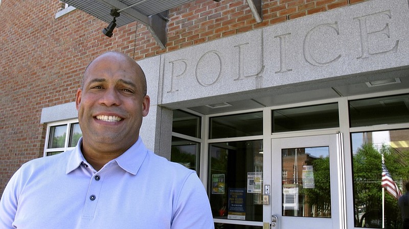 In this Thursday, June 18, 2020 photo, incoming police chief Brian Peete poses in front of the Montpelier, Vt., Police Department. Peete, the former police chief in Alamogordo, N.M., officially becomes police chief in Montpelier on July 1, but he's already on the job. He was chosen before protests sparked by the death of George Floyd in Minneapolis. (AP Photo/Wilson Ring)