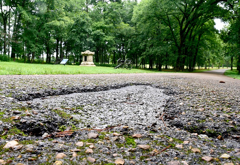 Staff Photo by Robin Rudd / A damaged portion of Glenn Kelly Road in Chickamauga National Military Park is seen in this July 1, 2020 photo.  According to park superintendent Brad Bennett, the majority of the park's needs is the resurfacing of some of the parks 25 miles of paved roads.  U.S. Senator Kelly Loeffler announced that $15.4 million in deferred maintenance projects at Chickamauga and Chattanooga National Military Park will be addressed through a fund created by the Great American Outdoors Act at no additional cost to taxpayers. 