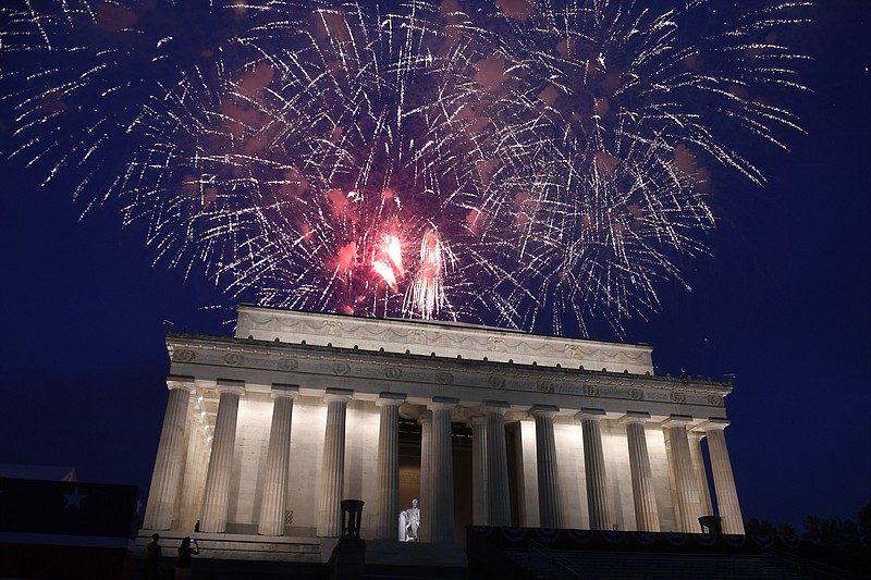 FILE - In this July 4, 2019 file photo, fireworks go off over the Lincoln Memorial in Washington, Thursday, July 4, 2019. The Trump administration is promising one of the largest fireworks displays in recent memory for Washington on July 4. It also plans to give away as many as 300,000 face masks to those who come down to the National Mall, although they won't be required to wear them. (AP Photo/Susan Walsh)



