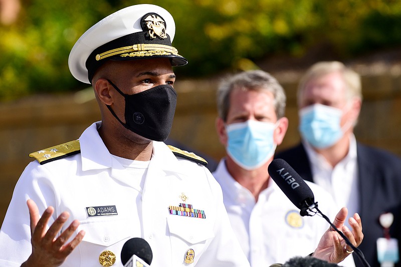 Staff Photo by Robin Rudd / United States Surgeon General Jerome Adams answers questions from the press while wearing a mask.  Gov. Brian Kemp was in Dalton Thursday morning, along with U.S. Surgeon General Jerome Adams as part of his statewide "Wear a Mask" tour. He's going around to different COVID hot spots and urging people to wear masks.
