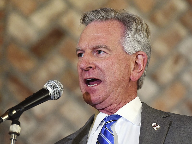 FILE - In this Monday, March 3, 2020, file photo, Alabama U.S. Senate candidate Tommy Tuberville speaks to his supporters at Auburn Oaks Farm in Notasulga, Ala. Tuberville's campaign bus went up in flames late Wednesday, July 1, 2020, on the side of a north Alabama interstate. (Joe Songer/AL.com/The Birmingham News via AP)