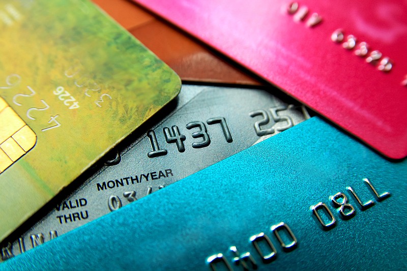 Stack of multicolored credit cards close-up view with selective focus. - stock photo debt tile credit card tile business tile money tile / Getty Images
