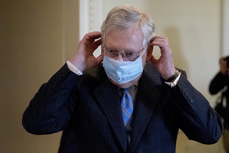 The Associated Press file photo / Senate Majority Leader Mitch McConnell of Kentucky, leaves a news conference on Capitol Hill in Washington recently wearing a mask.