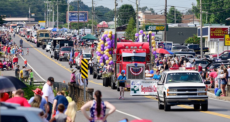 Staff Photo by Robin Rudd / The parade passes between the crowd on Rankin Ave.. The annual Fourth of July Parade in Dunlap, Tennessee was rerouted this year to allow from more social distancing during the COVID-19 pandemic. In past years the parade had traveled north to south along Rankin Ave.. This year the parade took a longer south to north route along Rankin Ave..