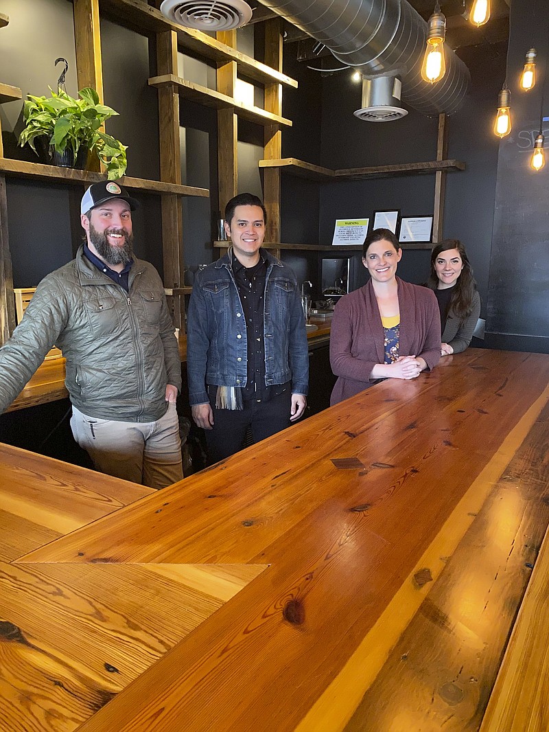 Photo by Barry Courter / Opened in the old 2 Sons space on M.L. King Boulevard, Proof is the brainchild of Michael Robinson, left, and Mia Littlejohn, third from left. Toby Darling, second from left, and Kaleena Goldsworthy manage the food and bar areas.