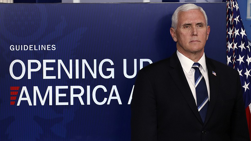Photo by Alex Brandon of The Associated Press / In this April 16, 2020, file photo, Vice President Mike Pence listens as President Donald Trump speaks about the coronavirus in the James Brady Press Briefing Room of the White House, in Washington.