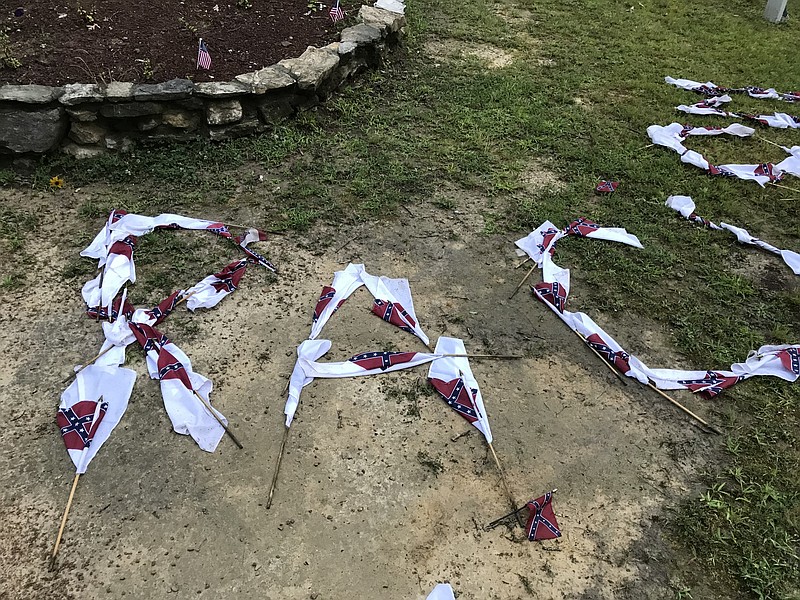 Photo contributed by the Gordon County Sheriffs Office / Small Confederate flags displayed at the Resaca Confederate Cemetery to spell "STOP RACISM."