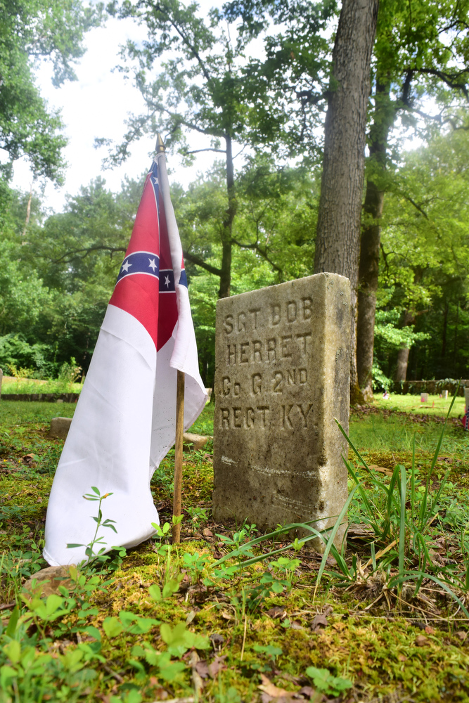Staff Photo by Robin Rudd / The Second National Flag of the Confederacy, also known as the "Stainless Banner," decorates the grave of Kentucky solider Bob Herret at the Resaca Confederate Cemetery. The site is the burial place of over 450 Confederate soldiers who died during the Battle of Resaca which took place May 14 and 15, 1864. Some of the soldiers were identified but 424 graves are marked "unknown".