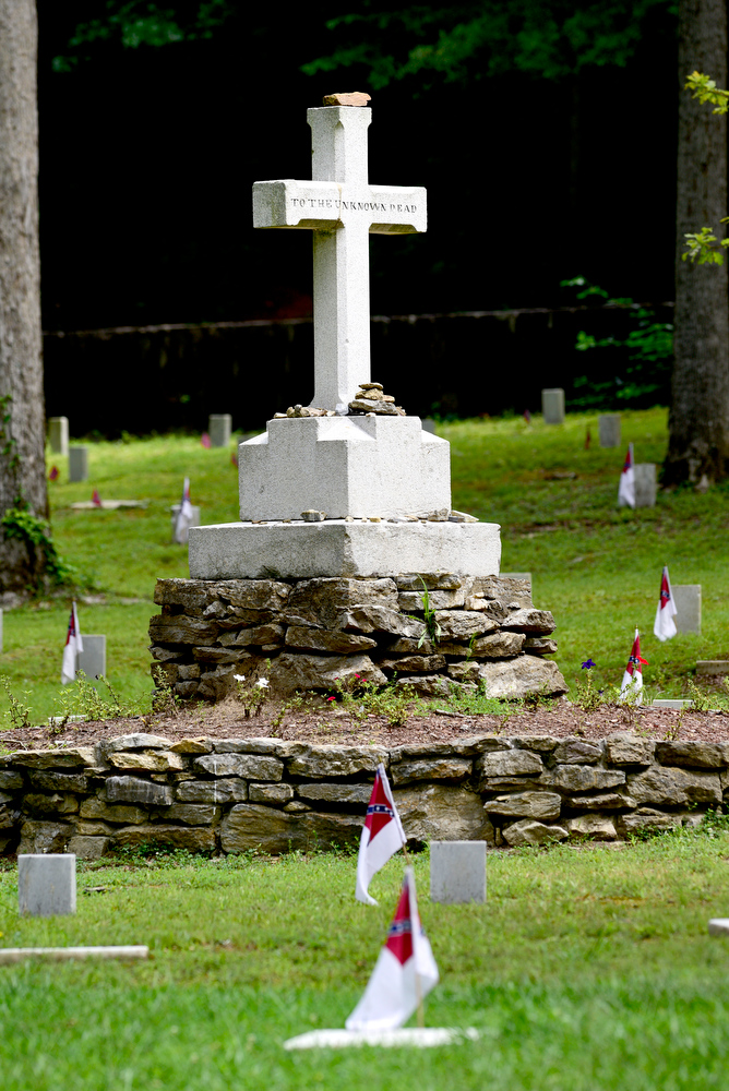 Staff Photo by Robin Rudd / At the center of the Resaca Confederate Cemetery stands a memorial cross, which the graves are arranged around. The site is the burial place of over 450 Confederate soldiers who died during the Battle of Resaca which took place May 14 and 15, 1864. Some of the soldiers were identified but 424 graves are marked "unknown".