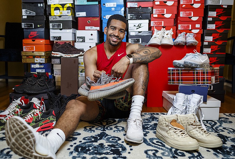 Staff photo / Jorden Williams is photographed with his collection of more than 200 pairs of limited edition sneakers at his Chattanooga home in June 2017. Williams played basketball at McCallie and Sewanee and has incorporated his enthusiasm for fashion into his current role as the operator of GoodTimesCLT, a retail store in Charlotte, N.C.