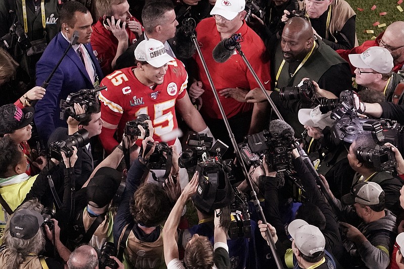 AP photo by Morry Gash / Members of the media surround Kansas City Chiefs quarterback Patrick Mahomes after he led his team to a comeback victory in Super Bowl LIV against the San Francisco 49ers on Feb. 2 in Miami Gardens, Fla.