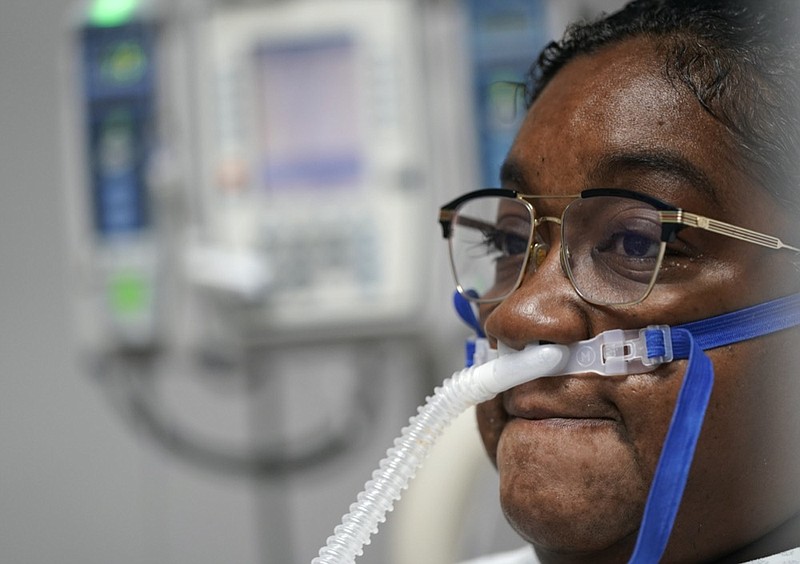 LaTanya Robinson pauses while talking about her ongoing recovery from COVID-19 inside the Coronavirus Unit at United Memorial Medical Center, Monday, July 6, 2020, in Houston. Robinson says she was caring for her son when he got the virus. Both she and her husband eventually caught it. While her son and husband's symptoms were relatively mild, she went from feeling tired and struggling to move to hardly being able to breathe. (AP Photo/David J. Phillip)

