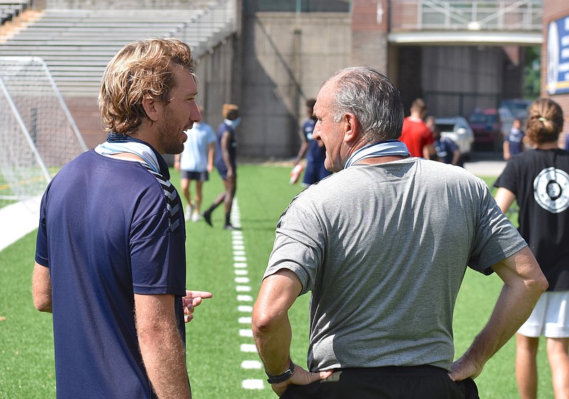 Staff photo by Patrick MacCoon / Chattanooga FC's Juan Hernandez, left, talks with head coach Peter Fuller after Thursday's practice at Finley Stadium. CFC will host the Georgia Revolution at 8 p.m. Saturday night. Fans will not be allowed, but the match will be broadcasted live on The CW.