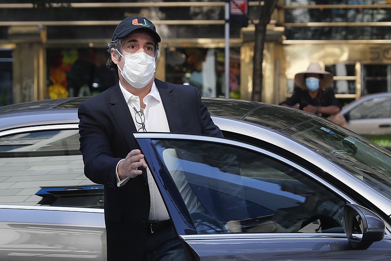 FILE - Michael Cohen arrives at his New York City apartment in this May 21, 2020 file photo. President Donald Trump's longtime personal lawyer and fixer was released federal prison and was expected to serve the remainder of his sentence at home. In a statement to The Associated Press on Thursday, July 9, 2020, the Bureau of Prisons said Cohen had "refused the conditions of his home confinement and as a result, has been returned to a BOP facility. (AP Photo/John Minchillo, File)


