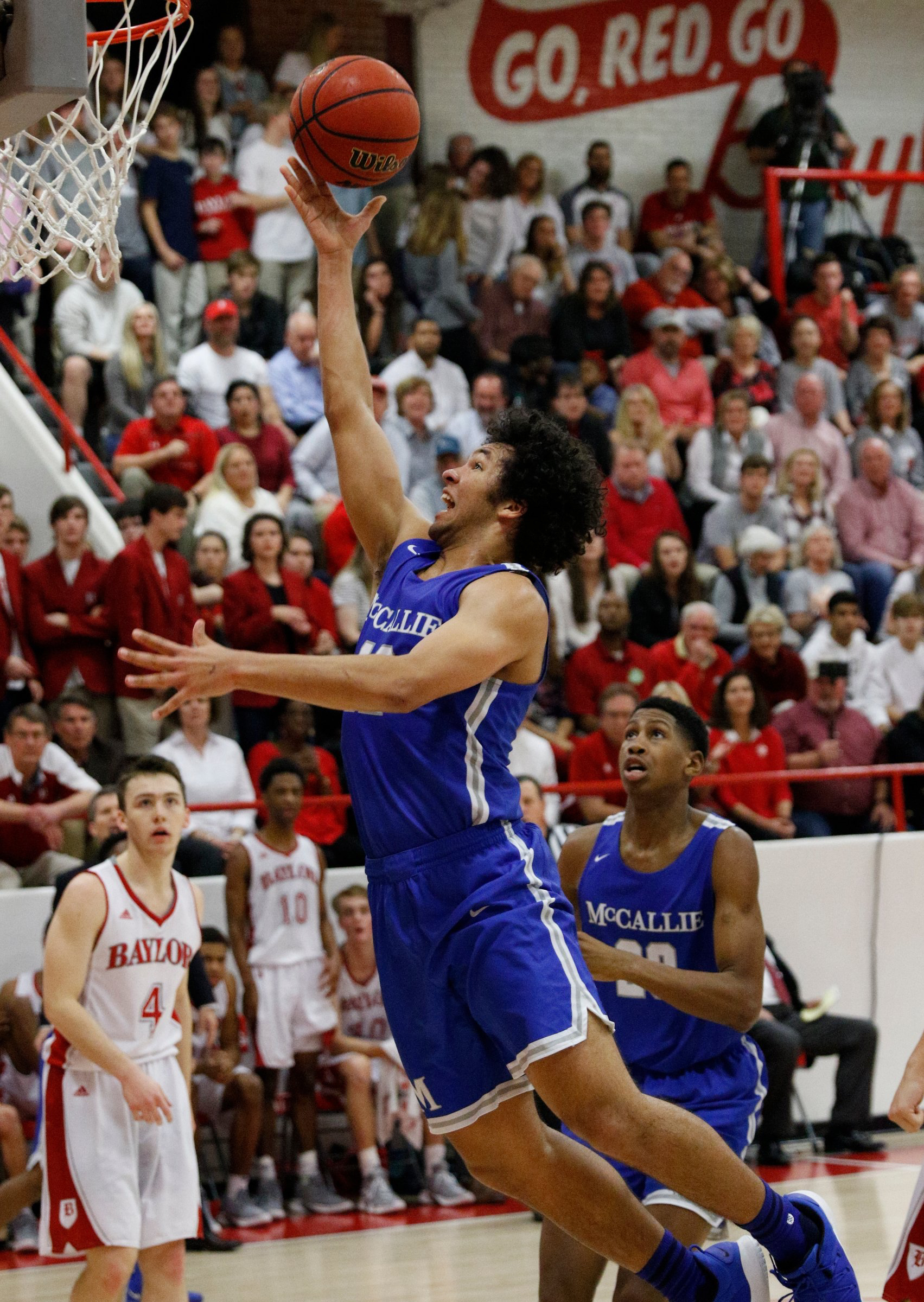 Staff file photo by Doug Strickland / McCallie's Anthony Watkins shoots ahead of teammate Tony Jackson during their prep basketball game at Baylor School on Friday, Jan. 18, 2019, in Chattanooga, Tenn.