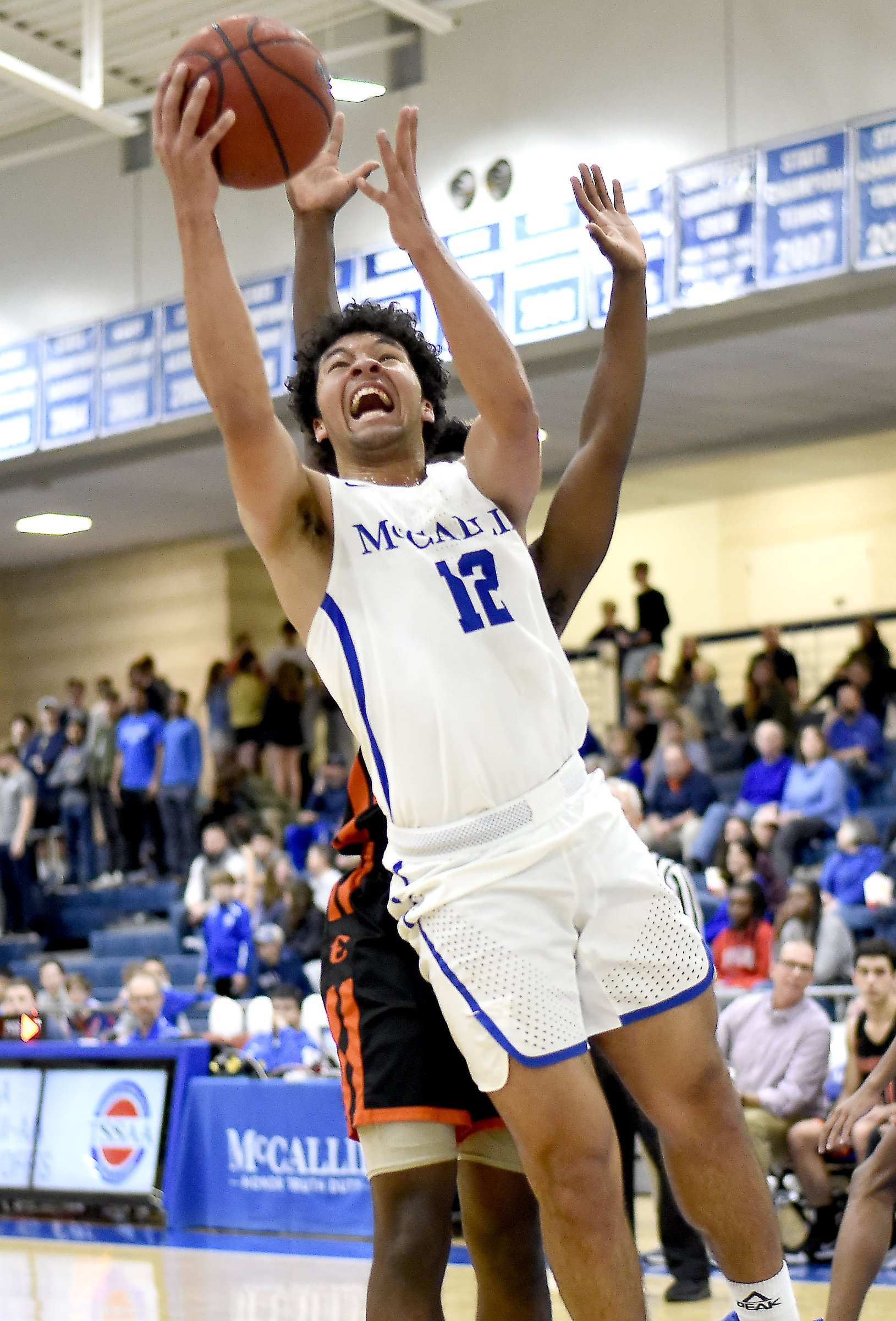Staff file photo by Robin Rudd/ McCallie's Anthony Watkins (12) drives to basket. The McCallie School hosted Ensworth in the II-AA boys' state tournament quarterfinals on February 23, 2019.