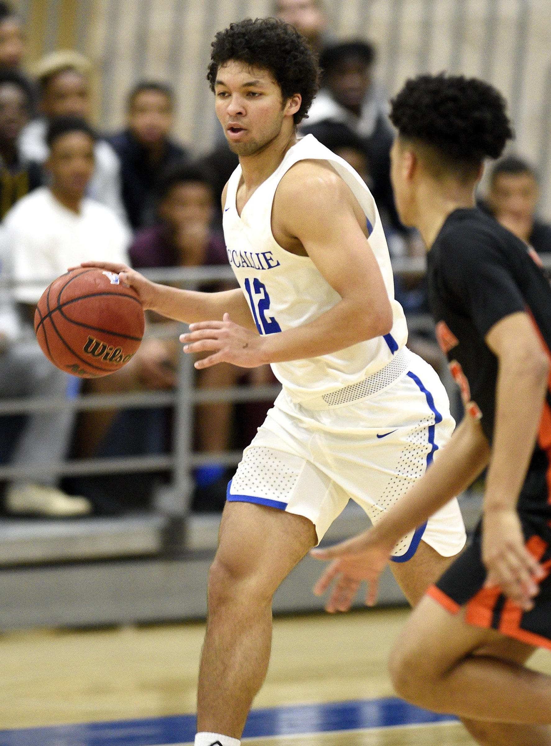 Staff file photo by Robin Rudd/ McCallie's Anthony Watkins (12) brings the ball upcourt. The McCallie School hosted Ensworth in the II-AA boys' state tournament quarterfinals on February 23, 2019.
