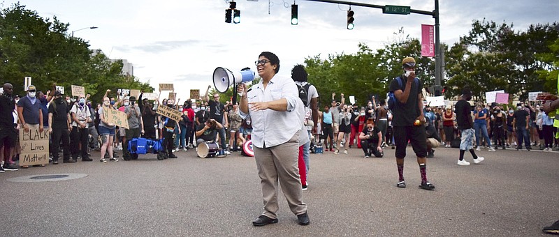 Staff Photo by Robin Rudd / Marie Mott addresses protesters at the intersection of Houston and Market streets on June 17, 2020.