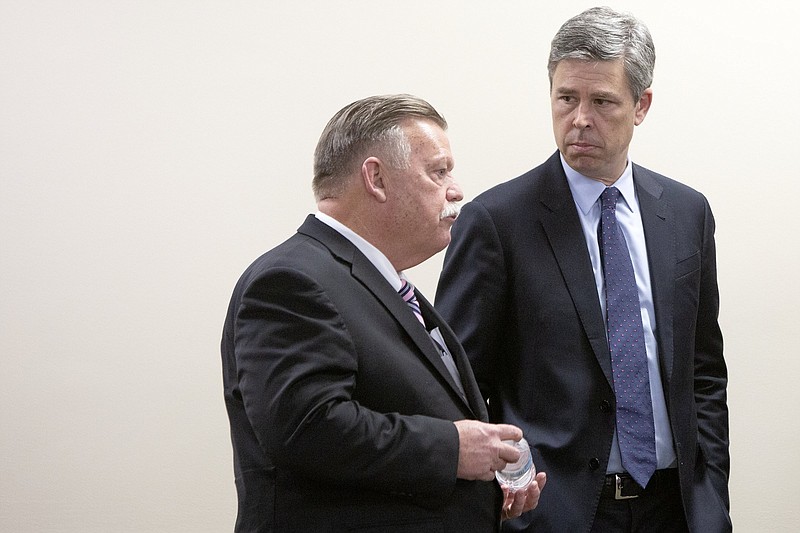 Staff photo by C.B. Schmelter / Mayor Jim Coppinger, left, and Mayor Andy Berke chat before a press conference at the McDaniel Building on Friday, March 13, 2020 in Chattanooga, Tenn.