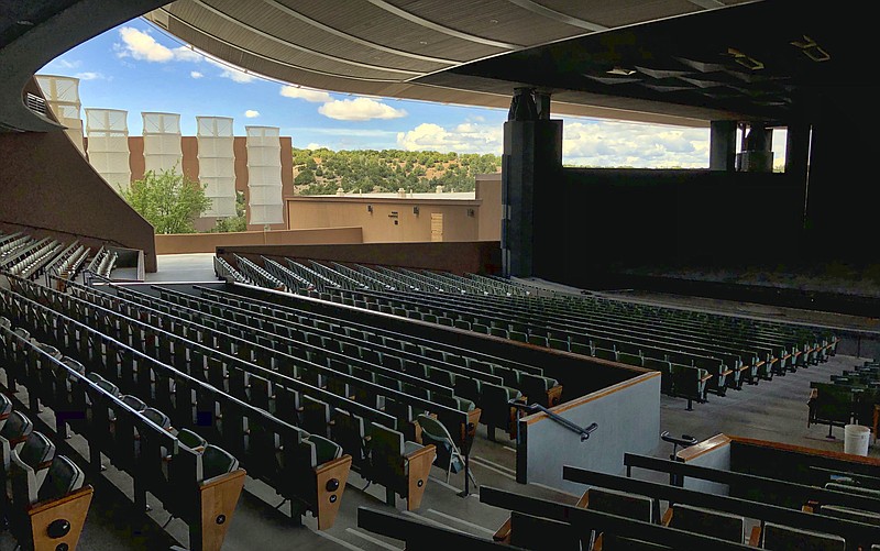 In this May 8, 2019, file photo, the Santa Fe Opera awaits its summer season in Santa Fe, N.M. The Santa Fe Opera, Meow Wolf and the non-profit organization that puts on the Albuquerque International Balloon Fiesta are among the New Mexico businesses that received loans from the federal government as part of massive effort to support the economy amid the coronavirus outbreak. (AP Photo/Morgan Lee, File)