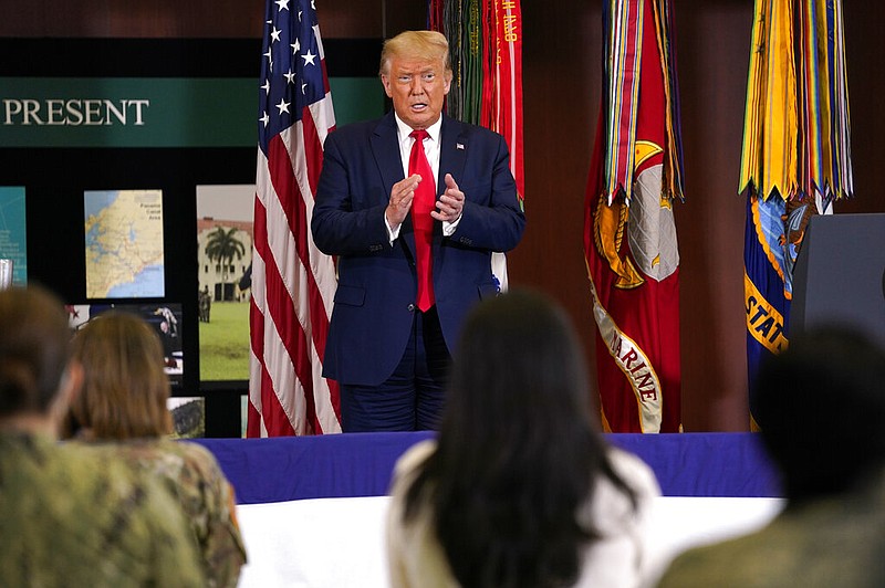 President Donald Trump claps after delivering a speech about the counternarcotics operations at U.S. Southern Command, Friday, July 10, 2020, in Doral, Fla. (AP Photo/Evan Vucci)