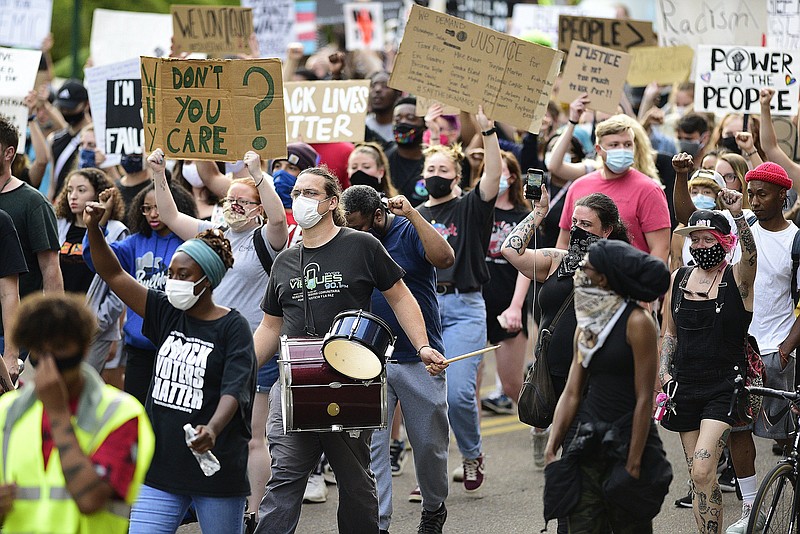 Staff Photo by Robin Rudd / A Chattanooga protest march heads south on Market Street in reaction to the death of George Floyd and other police brutalities on June 17, 2020.