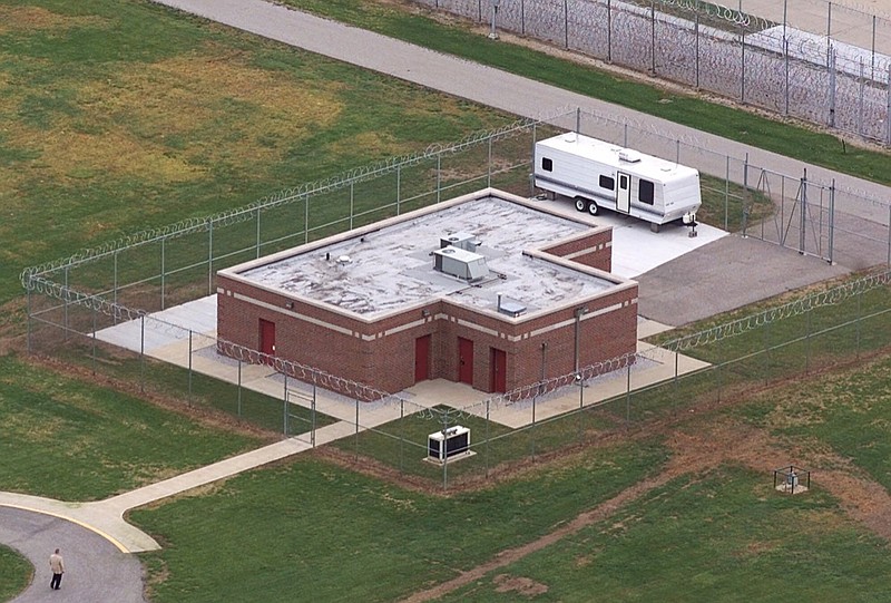 FILE - In this June 11, 2001 file photo, an aerial view of the execution facility at the United States Penitentiary in Terre Haute, Ind., is shown. After the latest 17-year hiatus, the Trump administration wants to restart federal executions this month at the Terre Haute, prison. Four men are slated to die. All are accused of murdering children in cases out of Arkansas, Kansas Iowa and Missouri. (AP Photo/Michael Conroy File)