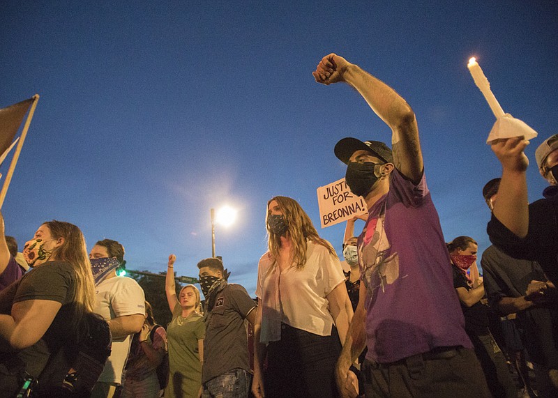 Staff file photo by Troy Stolt / Demonstrators pause at an intersection on Broad Street during a protest on June 5 in Chattanooga over police brutality after George Floyd was killed by Minneapolis police.