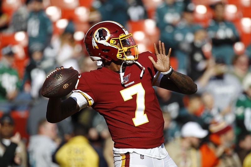 FILE - In this Dec. 15, 2019, file photo, Washington Redskins quarterback Dwayne Haskins warms up before an NFL football game in Landover, Md. A new name must still be selected for the Washington Redskins football team, one of the oldest and most storied teams in the National Football League, and it was unclear how soon that will happen. But for now, arguably the most polarizing name in North American professional sports is gone at a time of reckoning over racial injustice, iconography and racism in the U.S. (AP Photo/Patrick Semansky, File)

