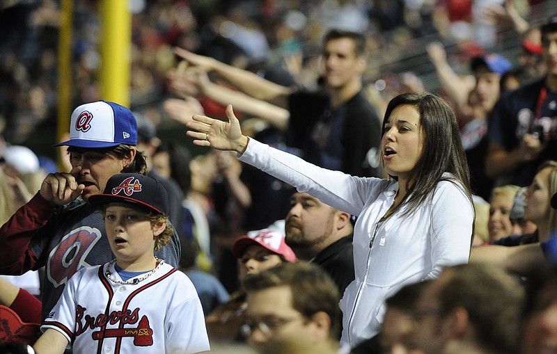 AP photo by David Tullis / Atlanta Braves fans do the tomahawk chop during the ninth inning of a home game against the San Francisco Giants on May 2, 2014.