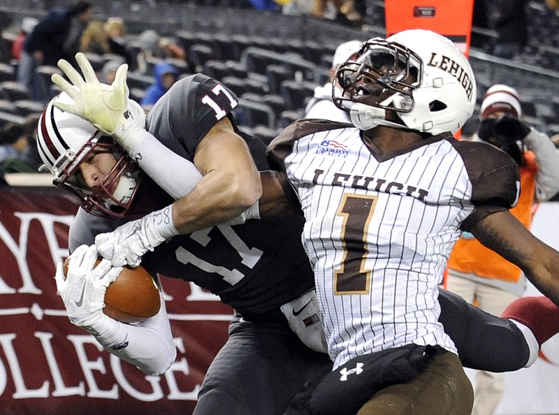 AP photo by Bill Kostroun / Lafayette wide receiver Matt Mrazek, left, catches a touchdown pass while covered by Lehigh cornerback Oliver Riguad during a Patriot League game on Nov. 22, 2014, at Yankee Stadium in New York.