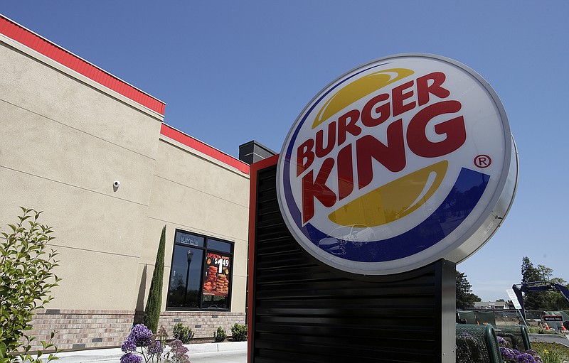 FILE - This April 25, 2019, file photo shows a Burger King in Redwood City, Calif. Burger King is announcing its work to help address a core industry challenge: the environmental impact of beef. To help tackle this environmental issue, the Burger King brand partnered with top scientists to develop and test a new diet for cows, which according to initial study results, on average reduces up to 33% of cows' daily methane emissions. (AP Photo/Jeff Chiu, File)