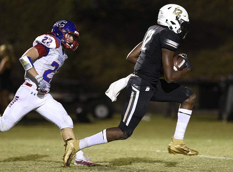 Staff photo by Robin Rudd / Bradley Central's Tray Curry outruns Cleveland's Parker Chastain on his way to the end zone during their rivalry game on Oct. 4, 2019. Curry announced his committment to Virginia Tech's football program on Tuesday.