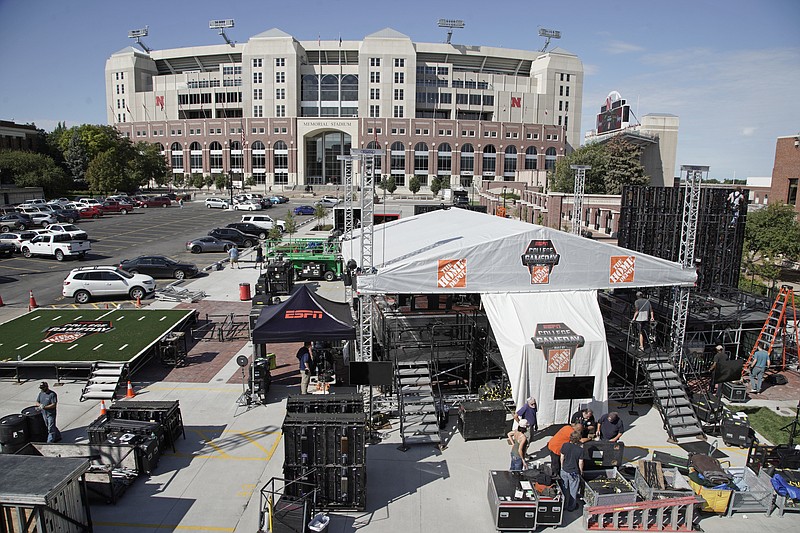 AP photo by Nati Harnik / Workers set up the ESPN "College GameDay" stage in front of Memorial Stadium on Sept. 26, 2019, in Lincoln, Neb.