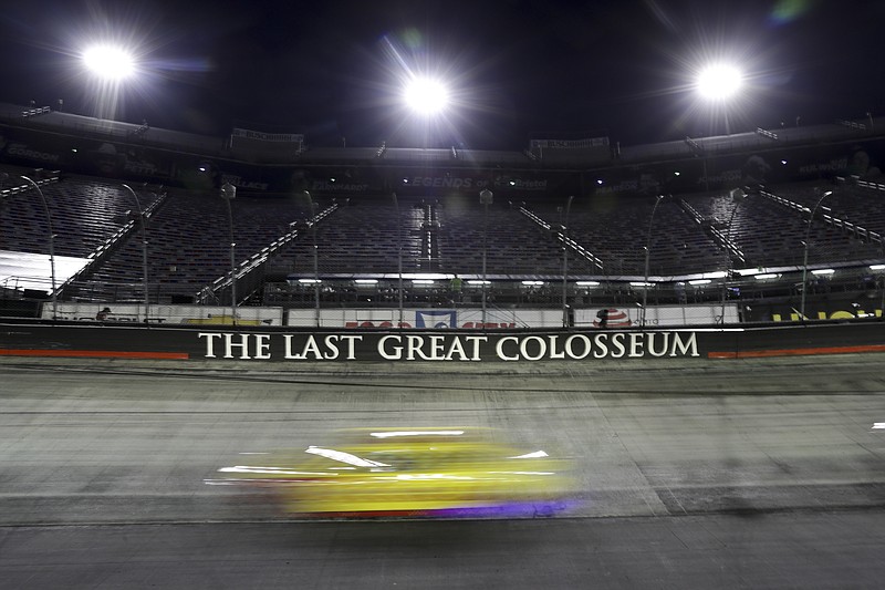 AP photo by Mark Humphrey / A car zips past during the NASCAR All-Star Race on Wednesday night at Bristol Motor Speedway in Tennessee.