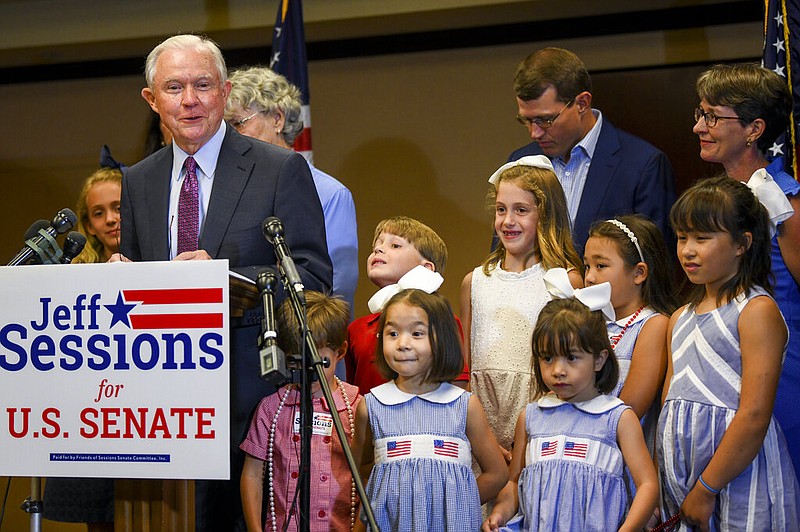 Former U.S. Attorney General Jeff Sessions, joined by family members, delivers his concession speech Tuesday, July 14, 2020, in Mobile, Ala. Sessions lost the Republican nomination for his old Senate seat to former college football coach Tommy Tuberville. (AP Photo/Julie Bennett)