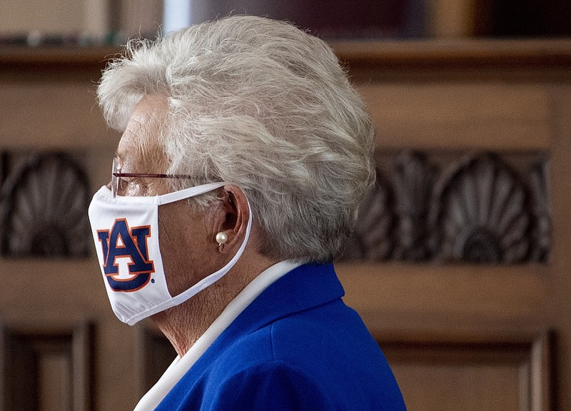 Alabama Gov. Kay Ivey wears an Auburn University mask as she arrives to announce a statewide mask order during a news conference in the state capitol building in Montgomery, Ala., on Wednesday, July 15, 2020. (Mickey Welsh/The Montgomery Advertiser via AP)
