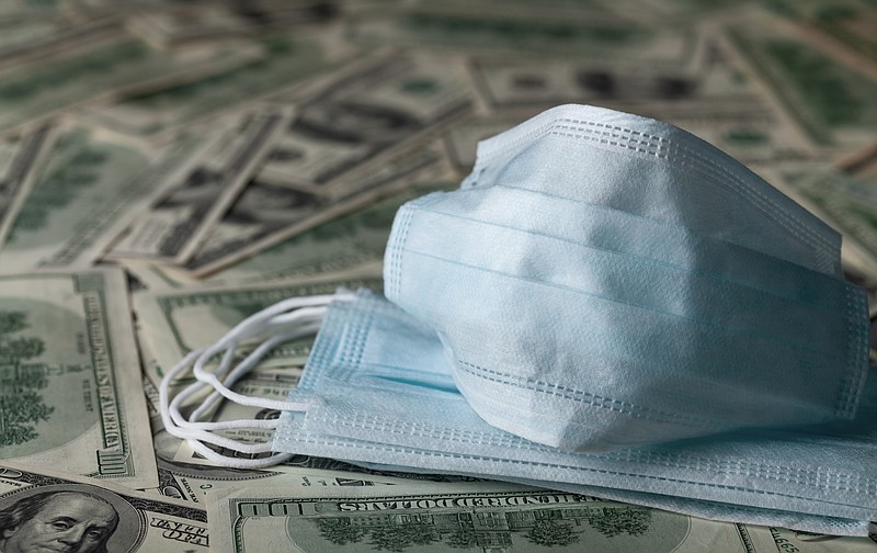 medical face mask and dollar banknotes, world coronavirus epidemic and economic losses concept. - stock photo cash tile money virus tile coronavirus tile covid-19 / Getty Images
